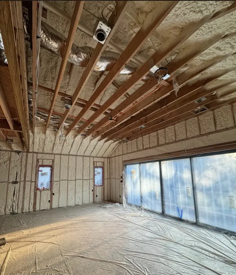 Interior walls and ceiling insulated with spray foam during new construction in Midvale